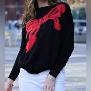 Women's Black Sweater with Red Bow Design
